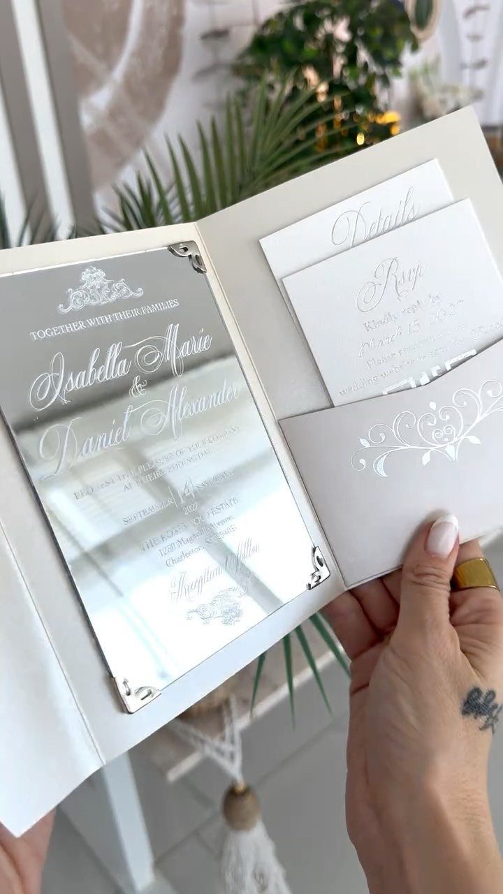 Wedding invitation suite with a mirrored main card and white RSVP inserts.