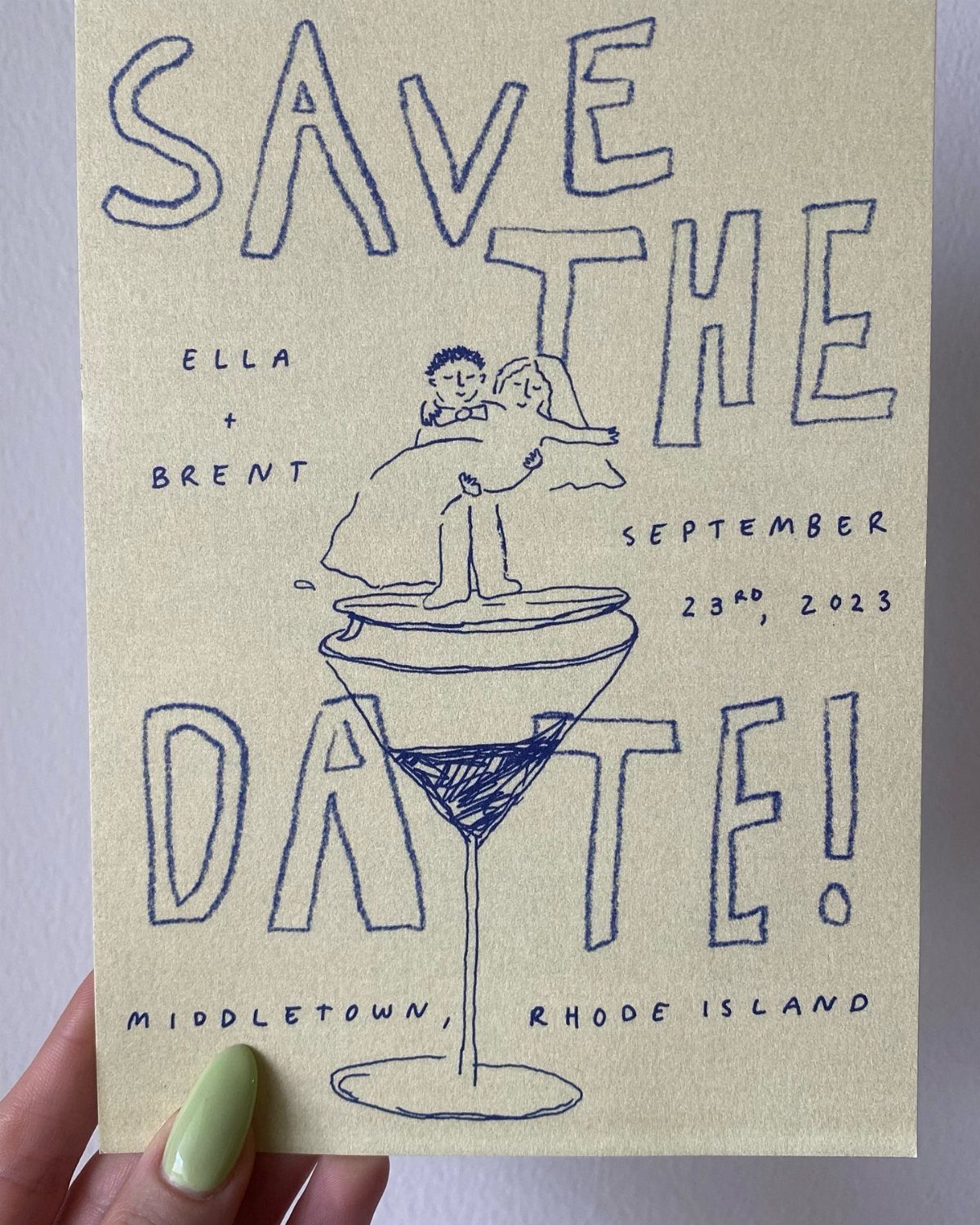 Hand-drawn save the date card featuring a couple inside a martini glass illustration.