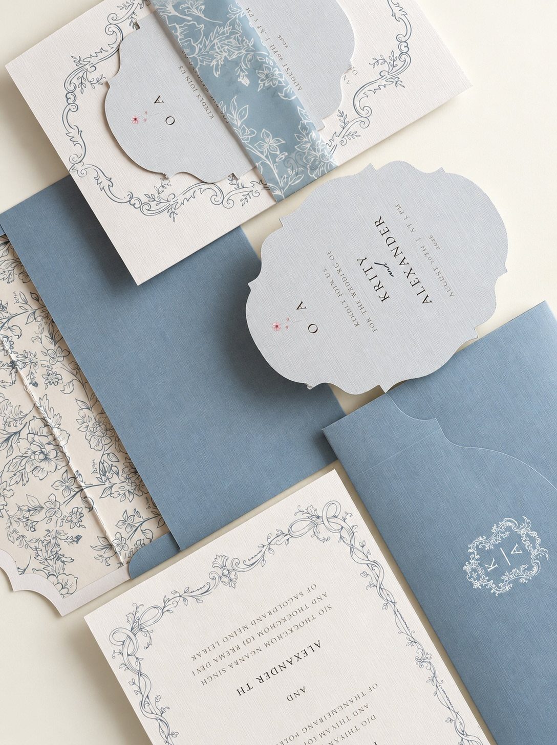 Die cut wedding invitations with scalloped edges in light blue and white tones.