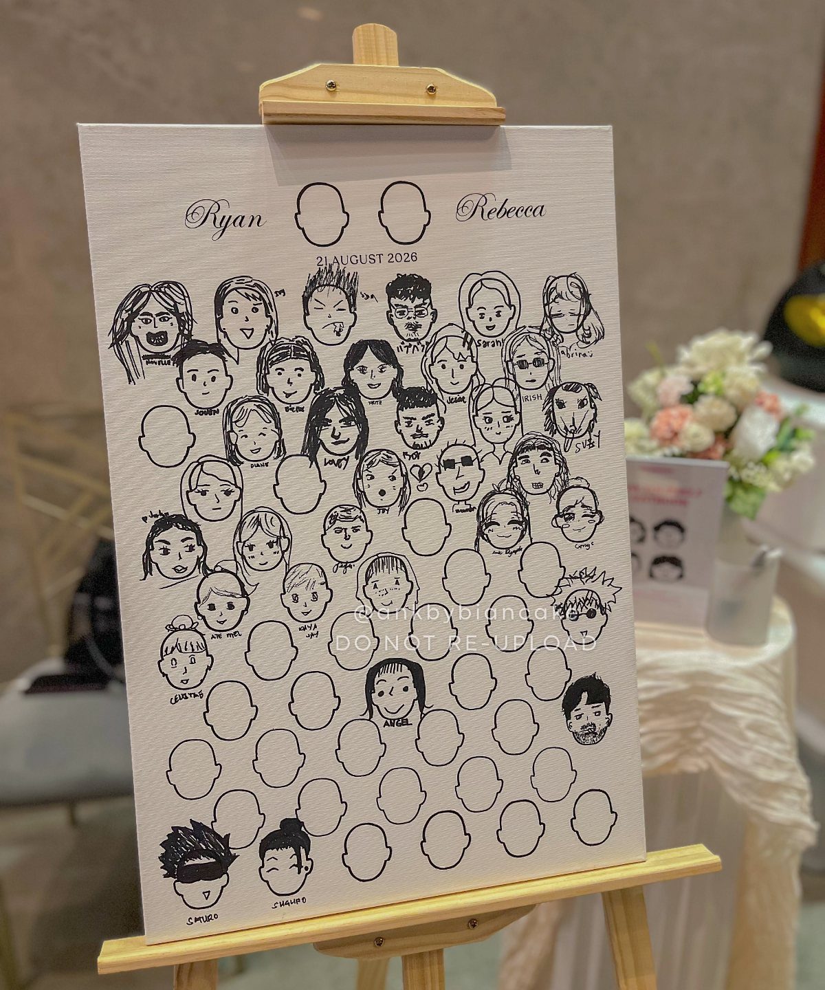 Canvas guest book on an easel with doodle portraits and blank face outlines.