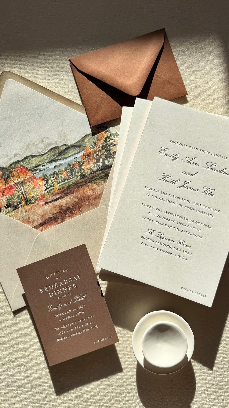 Wedding invitation suite featuring an envelope liner with autumn mountain foliage watercolor painting.
