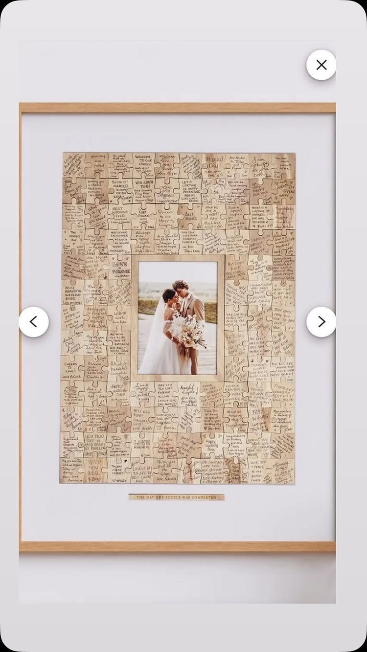 Framed wedding photo surrounded by puzzle pieces signed with handwritten guest messages.