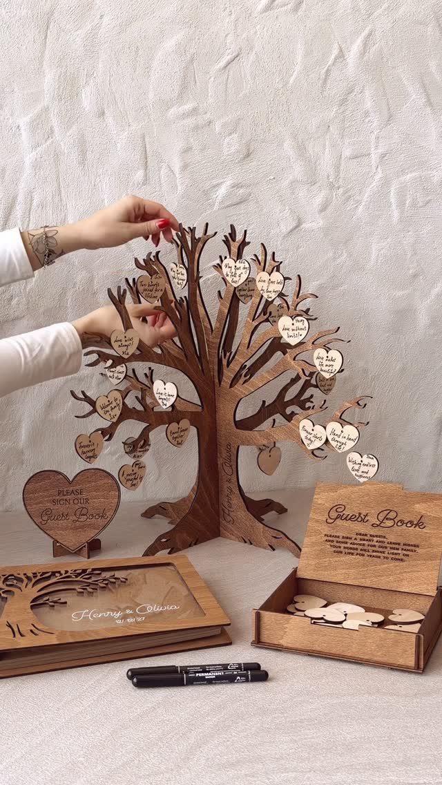 Wooden tree guest book with heart-shaped tags and matching wooden storage box.