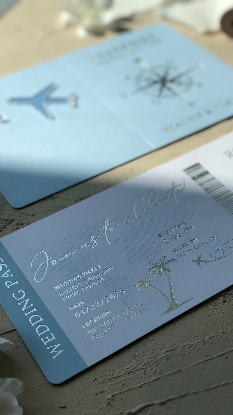 Light blue boarding pass wedding save the dates with airplane and palm tree icons.