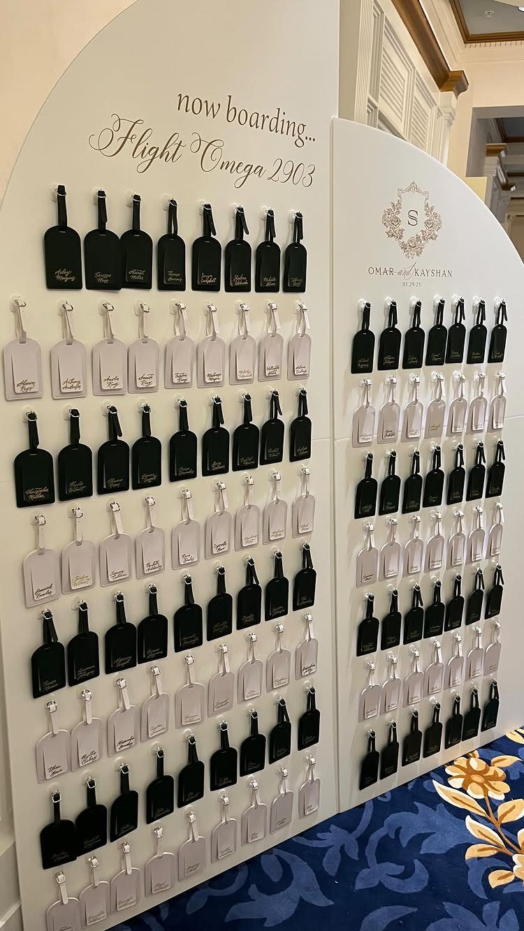 Luggage tag save the dates in black and white on a display board