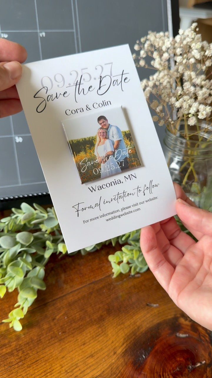 White save the date card with a small square photo magnet of a couple.