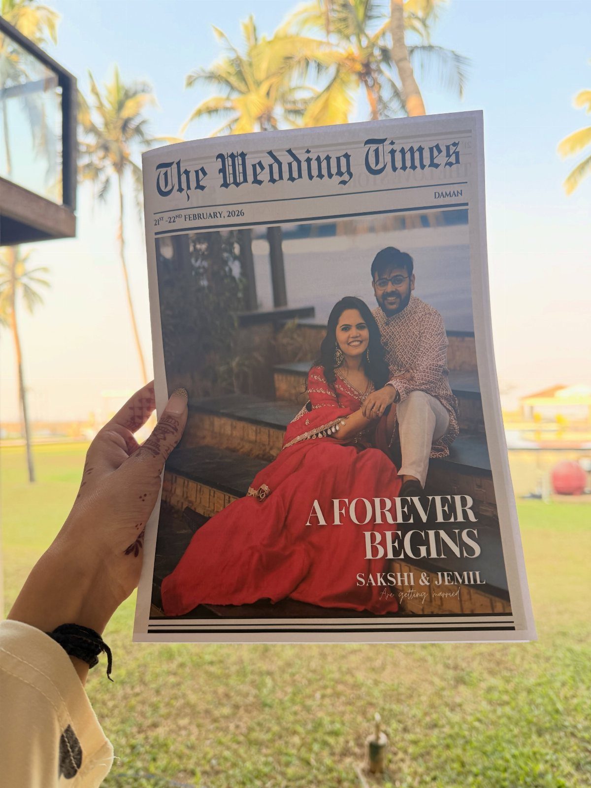 Wedding newspaper titled The Wedding Times featuring a couple in traditional Indian attire.