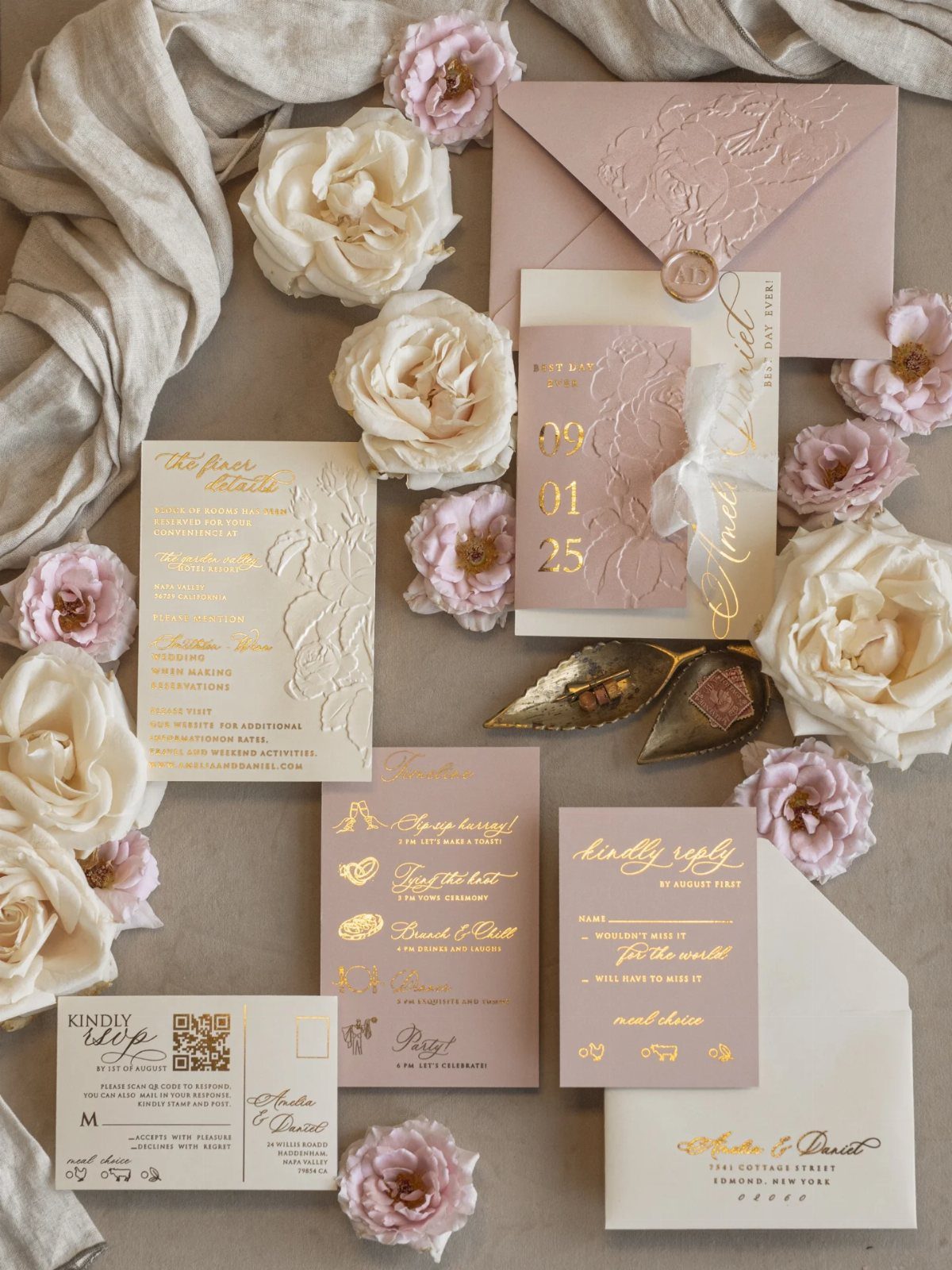 Blush and cream wedding invitation suite with gold foil and fresh roses.