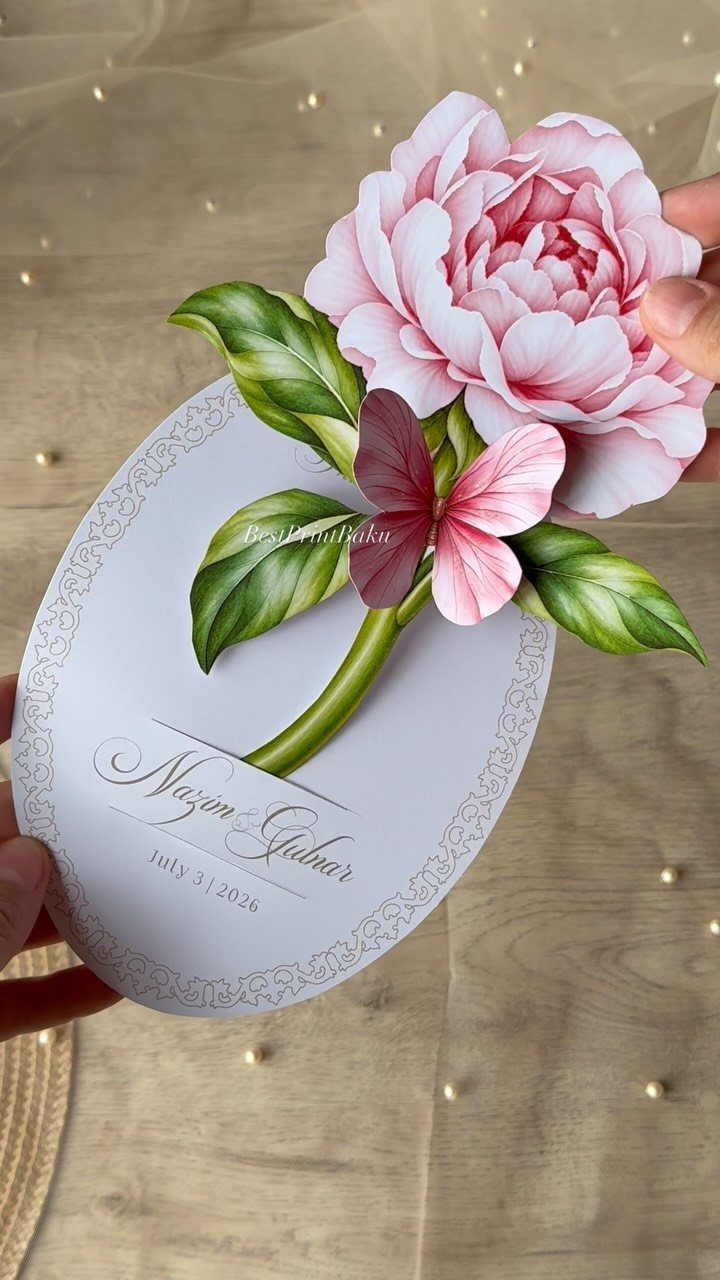 Oval white wedding invitation with a large 3D pink peony flower pop-up design.