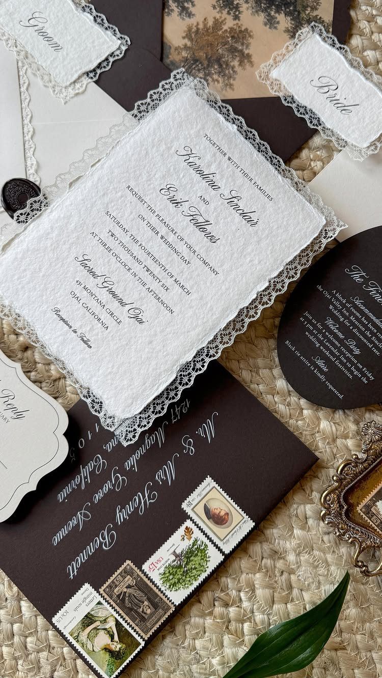 Vintage wedding invitations with lace edges, dark brown envelopes, and antique postage stamps.