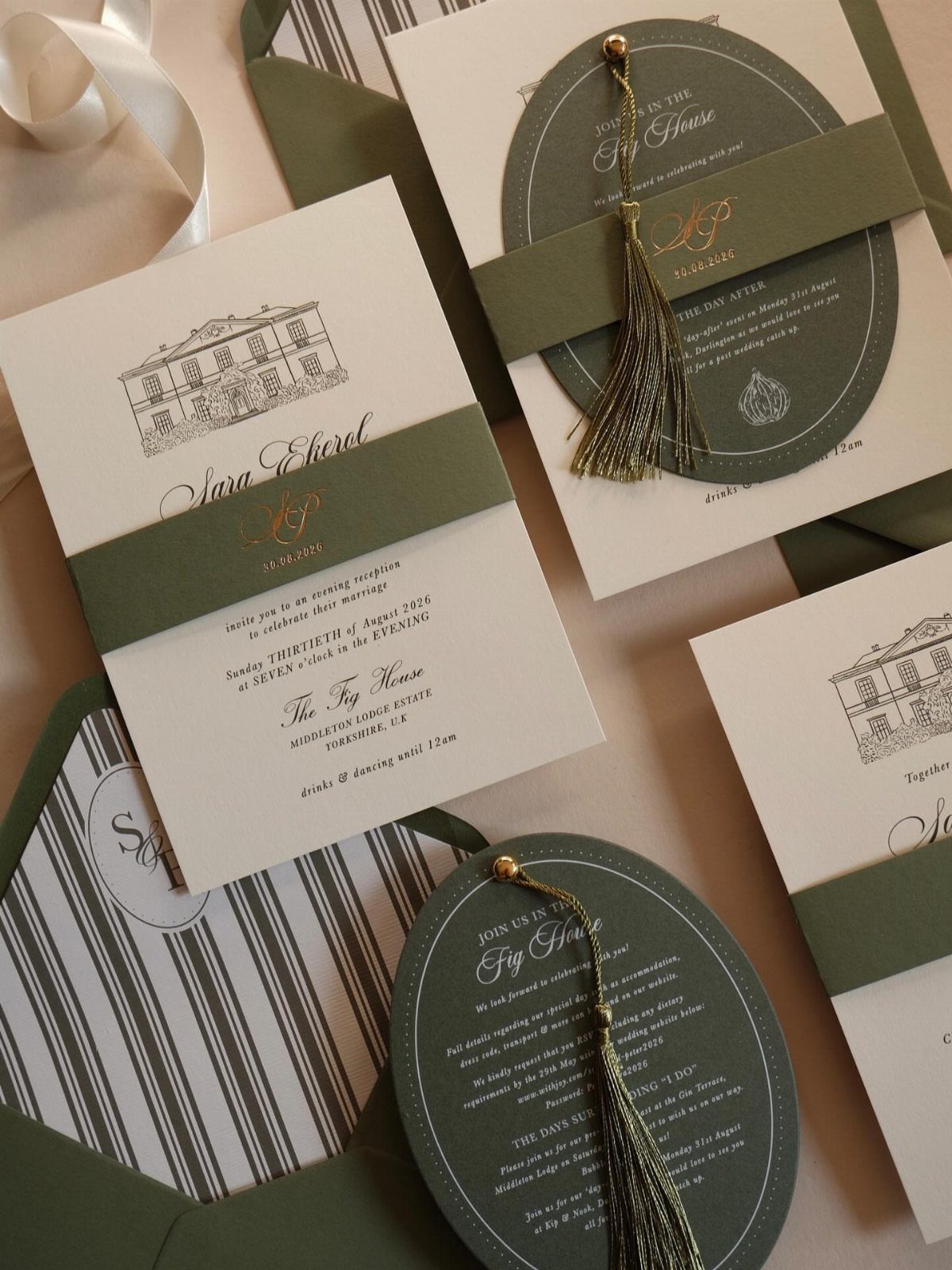 Sage green and white wedding invitations with gold text and decorative ribbons.