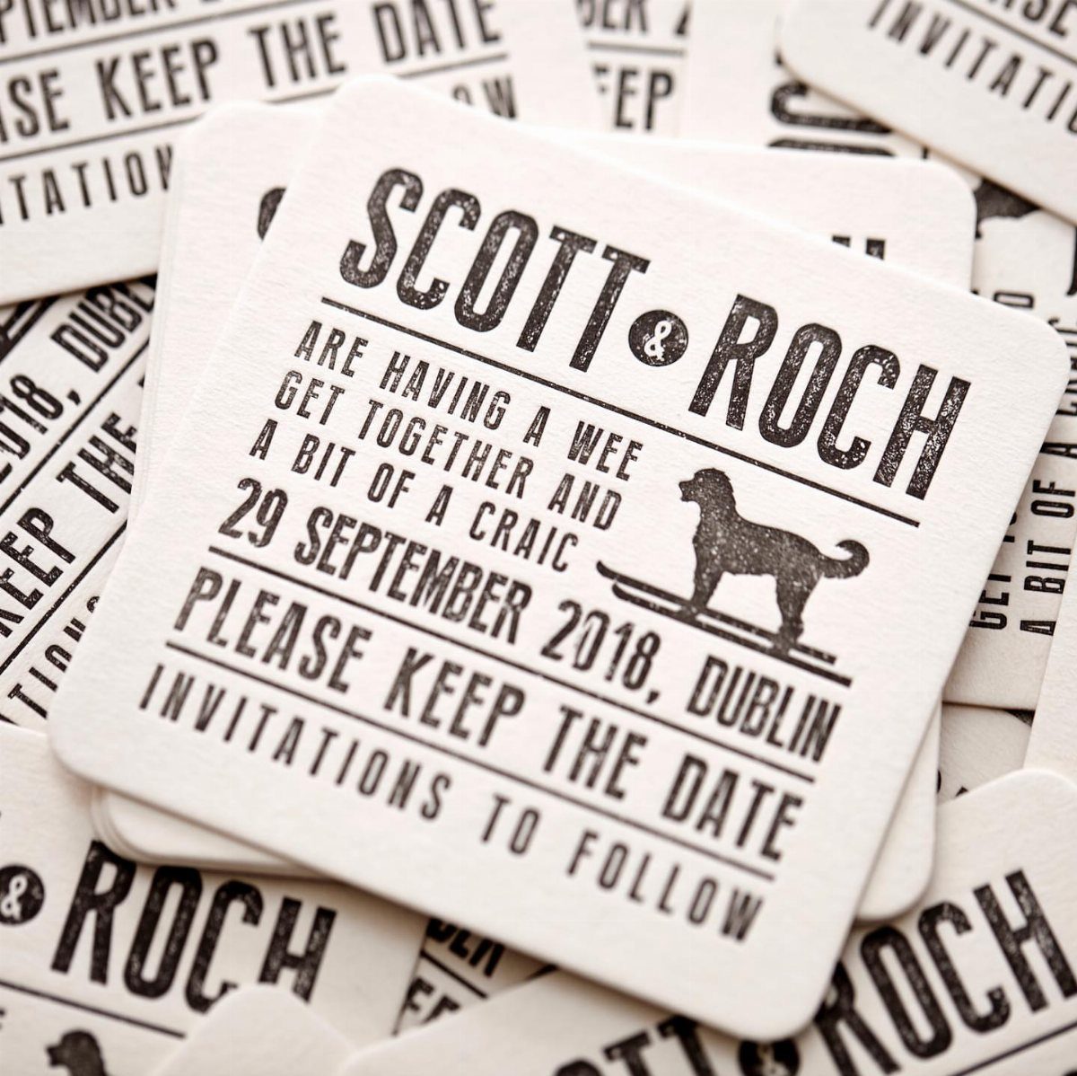 Square white coasters with black text announcing a save the date event.