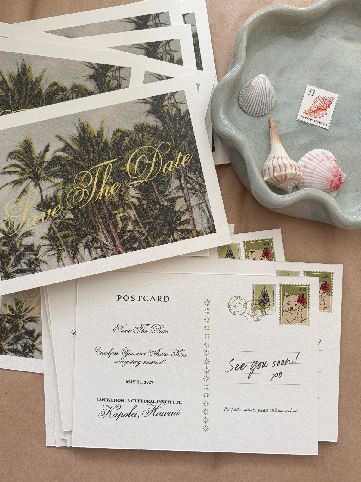 Save the date postcards with palm tree designs and a shell-shaped dish.