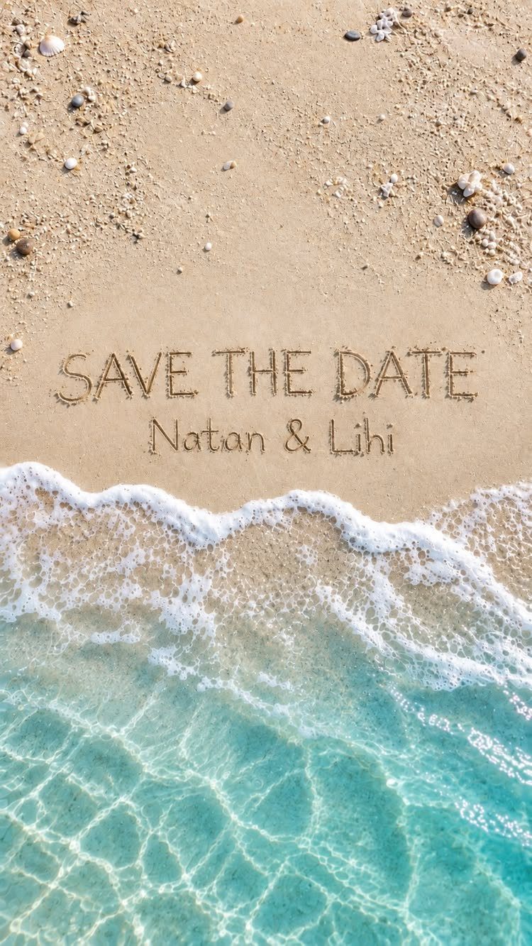 Save the date written in beach sand with turquoise ocean waves washing ashore.