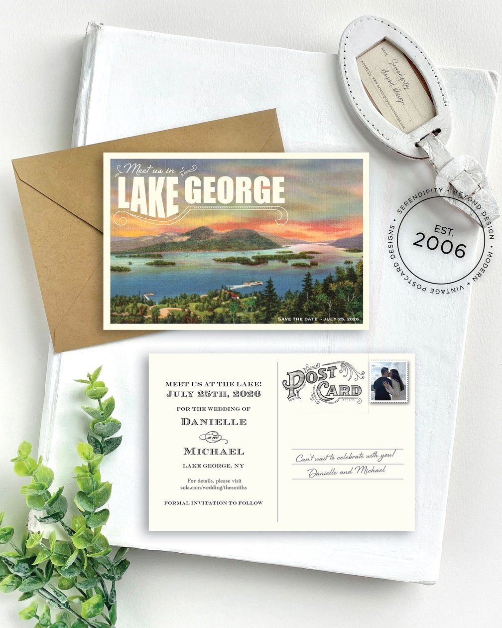 Vintage Lake George save the date postcard with matching envelope on white fabric.