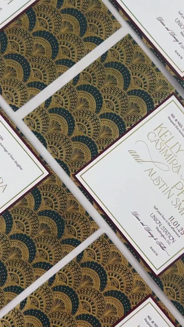 Wedding invitations with gold and teal Art Deco patterns and elegant black script.