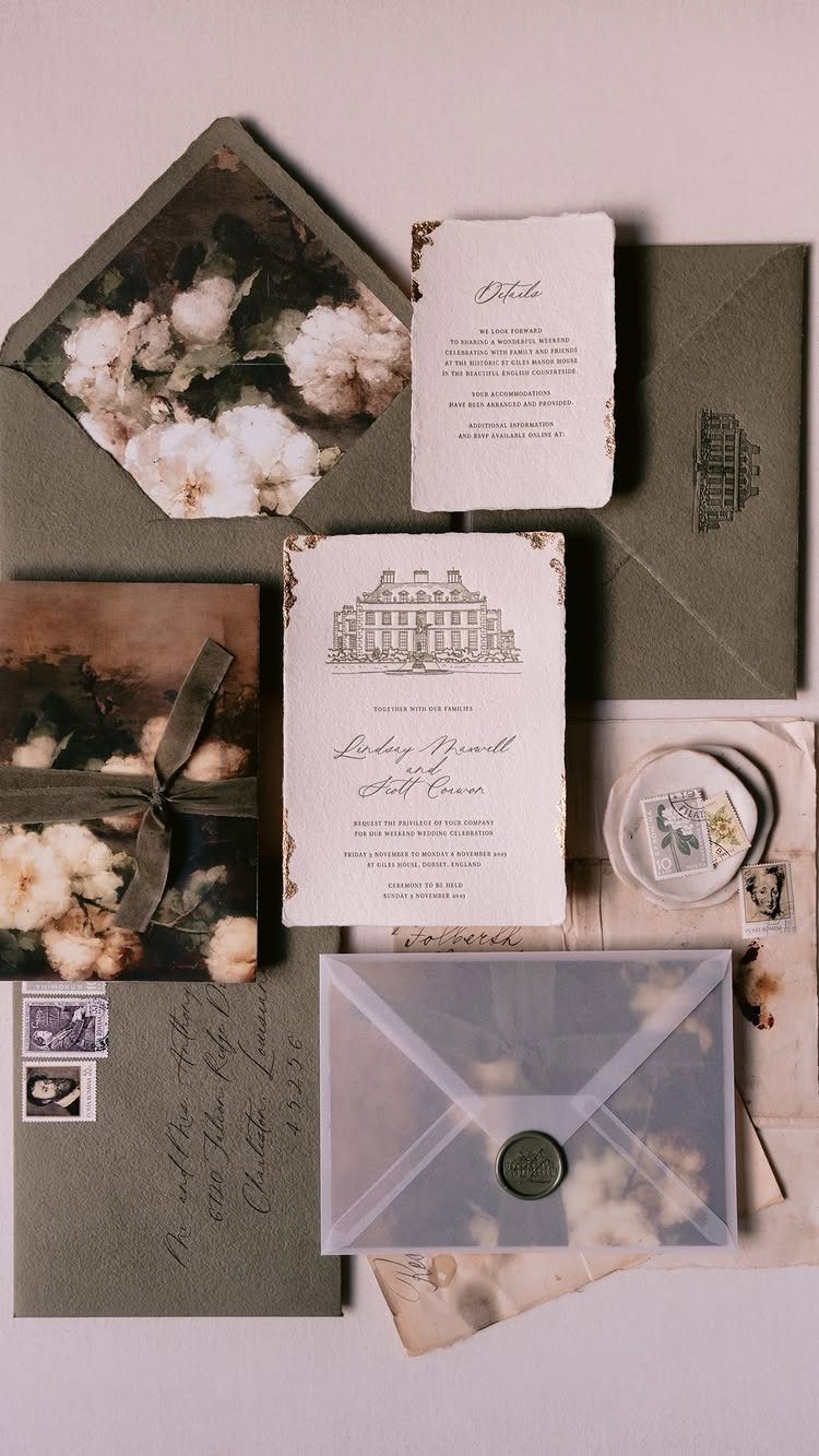 Wedding stationery set with floral envelopes, cream invitations, and a vellum wax seal envelope.
