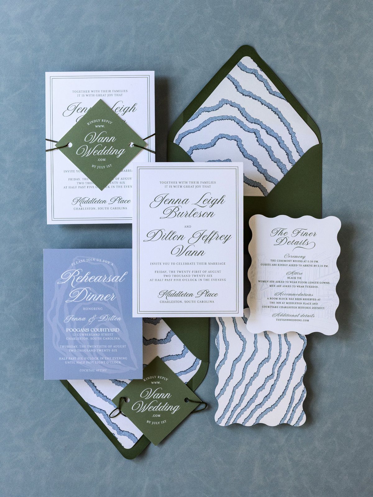 Wedding stationery set featuring olive green envelopes with blue wavy patterned liners.