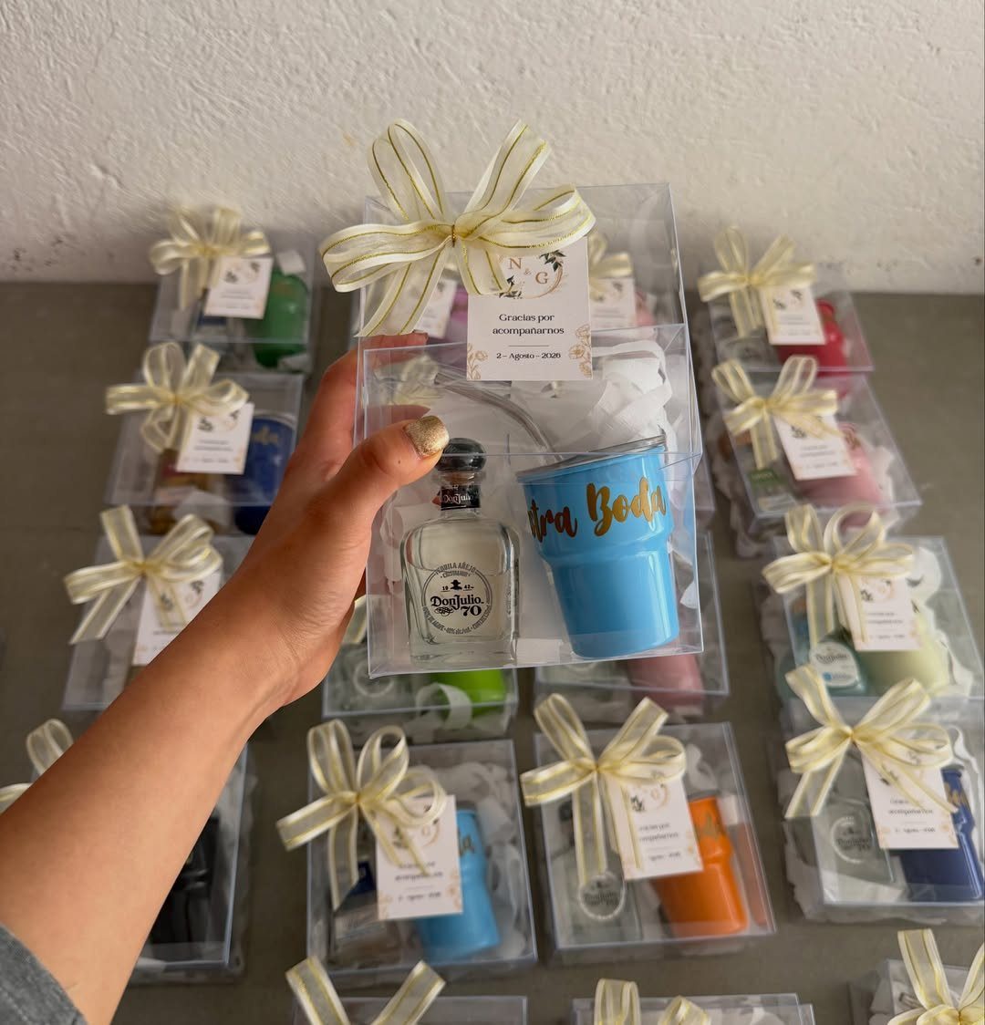 Mini tequila bottle and blue tumbler in a gift box with a card.